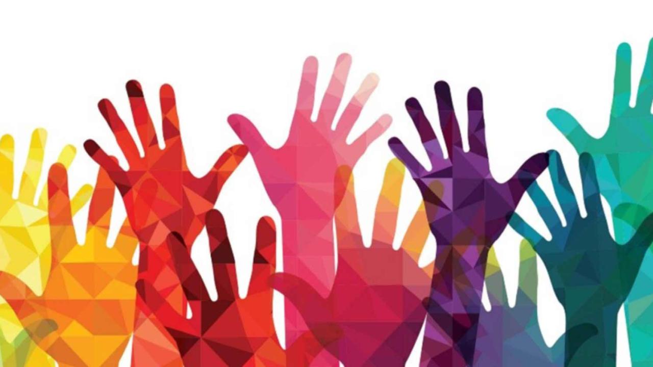 Colorful hands raised up