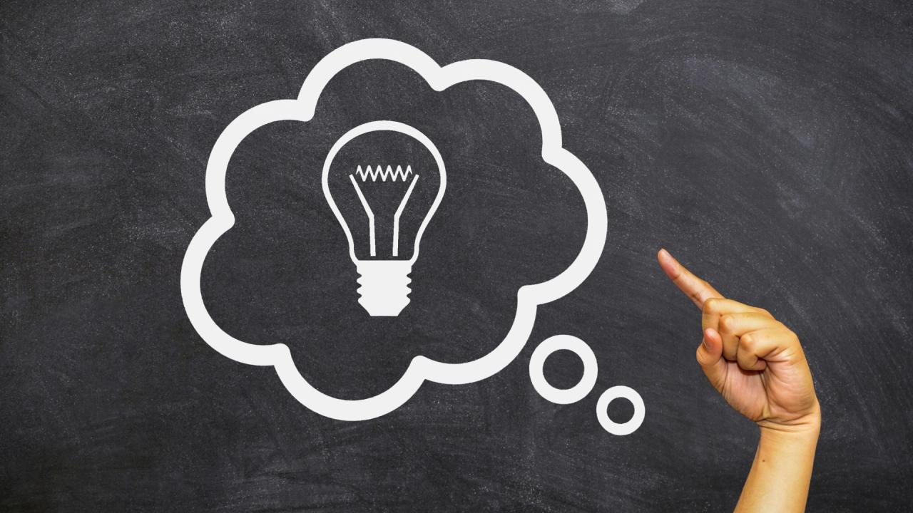 Lightbulb in thought bubble with hand pointing at it.