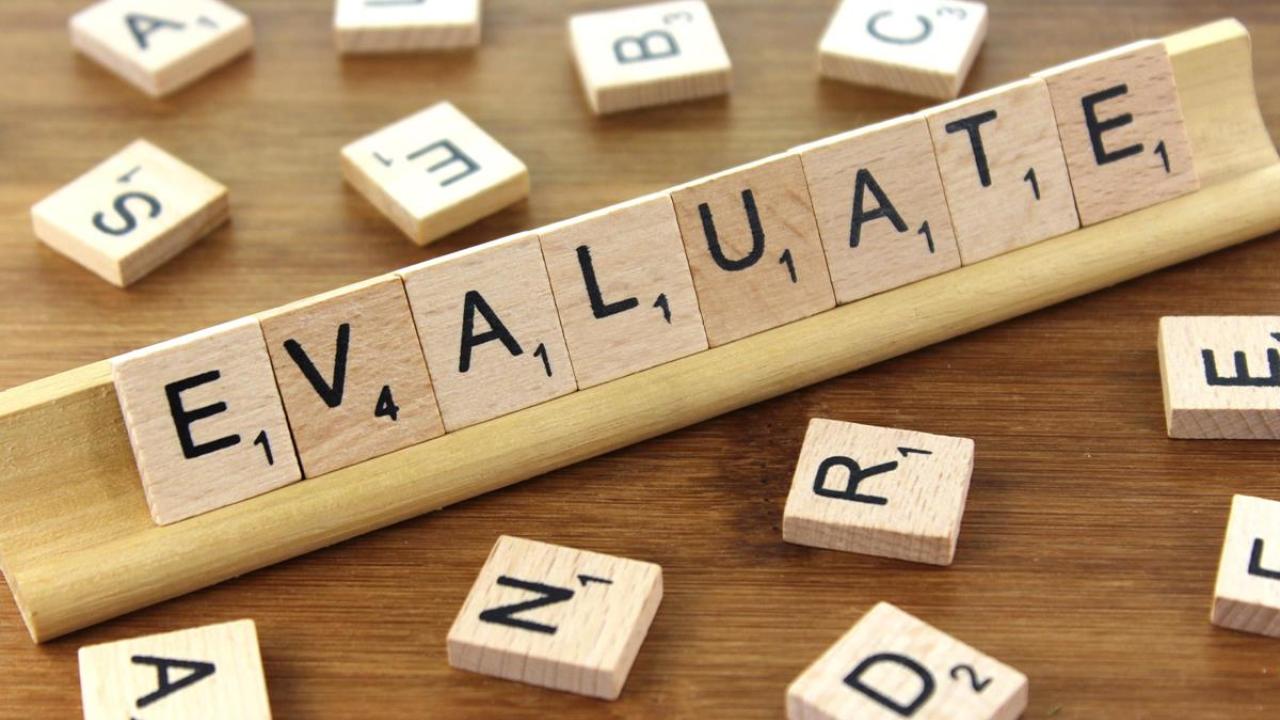Scrabble tiles spelling evaluate