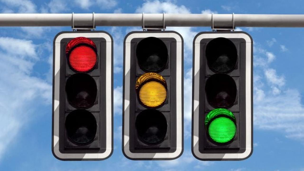 Stoplights with red light, green light, and yellow light.