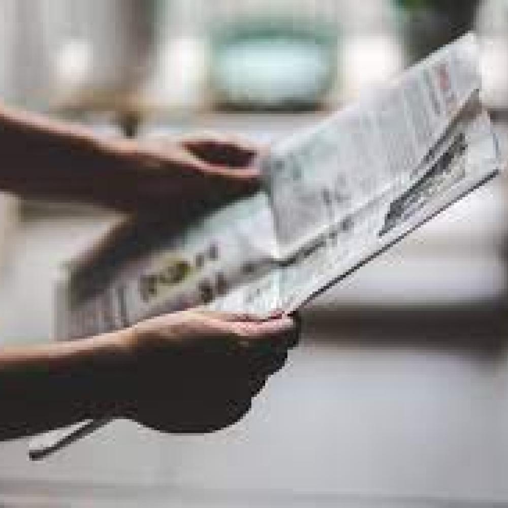Person reading a paper