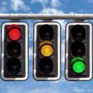 Stoplights with red light, green light, and yellow light.